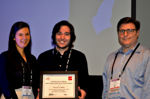 ASTC Fellow Mike McMackin (right) presents the ASTC-USITT Renovation Challenge Honor Award to KelseyLiz Habla and Charles Canfield from the University at Buffalo, recognizing their proposed renovation of the Cyclorama Building.